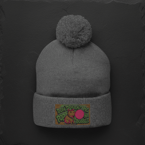 Capybara Pom-Pom Knit Cap detail — embroidered capybara design